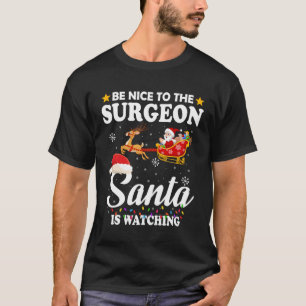 Be Nice To The Surgeon Santa Watching Xmas T-Shirt