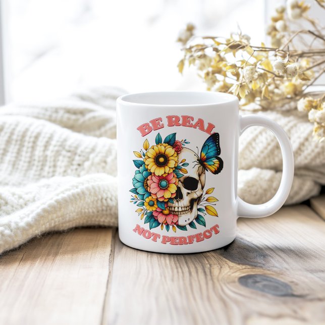 "Be Real Not Perfect" Floral Skull Butterfly Coffee Mug ("Be Real Not Perfect" Floral Skull Butterfly Coffee Mug on a shabby chic wooden table.)