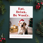 Be Woofy Funny Pet Dog Photo Christmas Holiday Card<br><div class="desc">Spread holiday cheer with the "Be Woofy Funny Pet Dog Photo Christmas Holiday Card." Featuring a charming dog wearing a Santa hat, this card brings a playful touch to xmas greetings. The phrase "Eat. Drink. Be Woofy." adds humour, while the festive setting with a decorated tree and gifts completes the...</div>