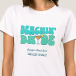 Beach Bachelorette Party Groovy Beachin Bride T-Shirt<br><div class="desc">Make a splash at your upcoming bachelorette party with this stunning beach bachelorette party personalized t-shirts. Whether you're celebrating a bach trip, a girls' vacation, or a best friends' holiday, this custom beach bachelorette party t-shirts are the perfect addition to your unforgettable getaway. Add a personal touch to your bachelorette...</div>