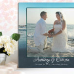 Beach Background Framed Wedding Photo Plaque<br><div class="desc">Standing photo frame plaque that is made to last. Blue ocean water and sky make up the background to frame a large photo of a couple on their wedding day. Names are added beneath the picture in elegant, swirling script. Another line of printed text can hold the date and location...</div>