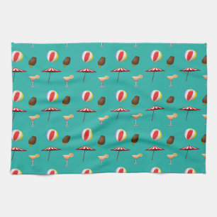 Beach balls, ice cream and cocktail on green kitchen towel