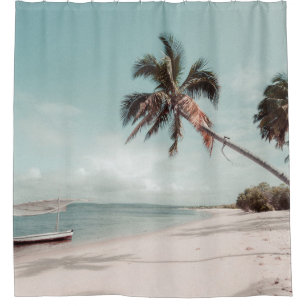 Beach beside coconut palm tree