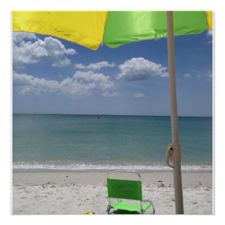 Beach chair and umbrella on the beach poster