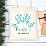 Beach Christmas Sand Dollar Starfish Aqua Blue  Tote Bag<br><div class="desc">Personalize this beach Christmas tote bag with aqua blue glitter coral,  white sand dollar and starfish,  and the holiday message “Seas & Greetings”.
*If you would like this design on more products or need design help,  please contact me through Zazzle Chat.</div>