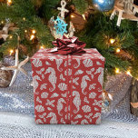 Beach Christmas Seahorses Pattern Red Wrapping Paper<br><div class="desc">This beautiful coastal Christmas wrapping paper features a silver glitter pattern of seahorses,  seashells,  and holly sprigs on a red background,  for a festive beach holiday design. If you would like this design on more products or other colorways,  or for other design-related enquiries,  please contact me through Zazzle Chat.</div>