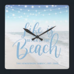 Beach House | Life Is Better At The Beach Square Wall Clock<br><div class="desc">Modern wall clock featuring string lights, a beach image and personalized with your your family name. The clock would make an gift for anyone who owns a boat or beach house. The fonts style, size and colour can all be changed by clicking on the customize further link after personalizing.</div>