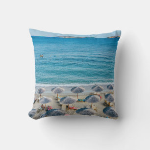 Beach lounge on seashore facing the sea throw pillow
