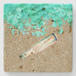 Beach message in a bottle shoreline ocean and sand stone coaster