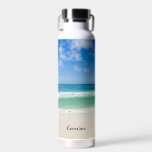 Beach Photography Blue Ocean Waves Personalized Water Bottle<br><div class="desc">This cool beach photography water bottle is perfect for a seaside restaurant or beachfront bar souvenir. A beautiful beach photograph taken in the ideal vacation destination of Destin, Florida. The gorgeous green waters of Sandestin wash up to the sandy seashore underneath serene blue skies to make the perfect scenic vacation...</div>