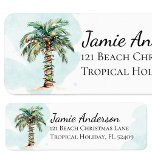 Beach Return Address Labels | Christmas Palm Tree<br><div class="desc">A chic watercolor palm tree wrapped with Christmas lights adorn these beach return address labels. Light blue watercolor splashes accent the background.  Personalized with your name and address.  Attach to your envelopes to send out coastal holiday cheer to your loved ones.</div>