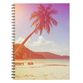 Beach scene, coconut tree, wooden bed. notebook