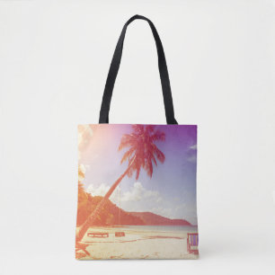 Beach scene, coconut tree, wooden bed. tote bag
