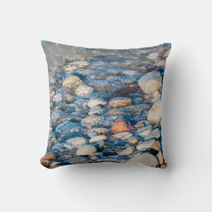 Beach stones on the lake shore throw pillow
