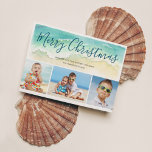 Beach Vacation Merry Christmas Photo Holiday Card<br><div class="desc">Send warm season's greetings with this beach-themed Christmas card. The coastal holiday photo cards features a sea green watercolor wave upon a sandy shore. Script lettering atop the wave reads "Merry Christmas" in a pretty blue-green ocean colour. Three photos are placed below the painted wave. To personalize, add your names...</div>