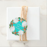 Beach Wreath Seas and Greetings Christmas Favour Tags<br><div class="desc">Seas and greetings Christmas beach themed tie-on tags. Tropical turquoise colour with custom text in the centre. Round, scalloped tags have sand dollars and starfish border and solid blue on reverse. Every shape tag will work with this design, but the image placement may change. Tags will print as you see...</div>