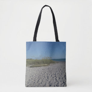Beached kayak on an all-over printed tote bag