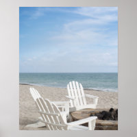 beachfront house with adirondack chairs and
