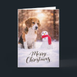 Beagle Christmas Snowman Card<br><div class="desc">A charming Christmas card featuring a Beagle sitting in fresh winter snow beside a cheerful little snowman wrapped in a red scarf. Warm golden winter light and softly falling snow create a peaceful holiday moment that perfectly captures the curiosity and gentle nature Beagles are known for. This card is perfect...</div>