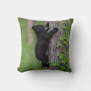 Bear Cub Climbing a Tree Throw Pillow