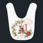 Bear Poinsettia Foliage Baby's First Christmas Bib<br><div class="desc">This design features Christmas teddy bear with Santa hat and presents inside Christmas wreath with poinsettia,  greenery foliage and red berries. You can adjust text according to your requirements.</div>