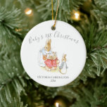 Beatrix Potter Peter Rabbit Baby’s 1st Christmas Ceramic Ornament<br><div class="desc">Sweet little watercolor Beatrix Potter Mama rabbit with baby bunnies Baby’s 1st Christmas ornament.  So cute for that baby boy or girl.  Makes a great baby shower gift.  100% customer satisfaction with “Zazzle”</div>