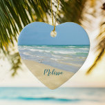 Beautiful Beach Photo Personalized Heart Christmas Ceramic Ornament<br><div class="desc">Beautiful heart shaped beach ornament with gorgeous seaside photography featuring a pretty sandpiper standing at the edge of the ocean waves on a sunny summer day. Lovely blue green water waves roll onto the sandy shore where your name is personalized in cute teal typography. A beautiful Christmas gift for a...</div>