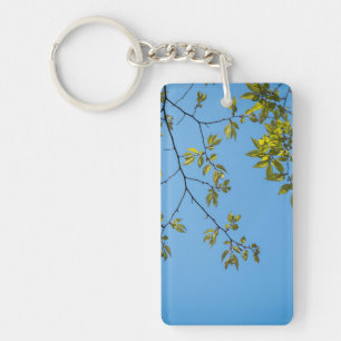beautiful branch with green and yellow leaves hug keychain