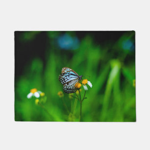 Beautiful Butterfly on a flower Doormat