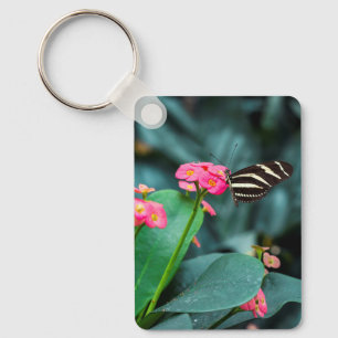 Beautiful butterfly on a pink flower keychain