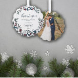 Beautiful Christmas Florals Wedding Thank You Ornament Card<br><div class="desc">Pretty Christmas wedding thank you ornament personalized with your wedding photo on one side and on the other your shared last name with the year framed by pretty bouquets of Christmas flowers in white, red, blue, and green on the other side. Thank you wedding guests for sharing your special day...</div>