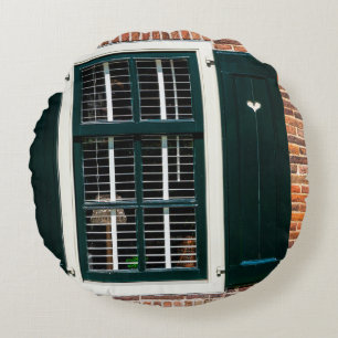 Beautiful dutch traditional houses. Brick wall wit Round Pillow