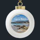 Beautiful Laguna Beach Ceramic Ball Christmas Ornament<br><div class="desc">This ornament makes a unique keepsake to remember any visit to fabulous Laguna Beach.  Change the date to the current year.  The font style can be changed as well as the size,  colour and location.  Three options for the back image also.</div>