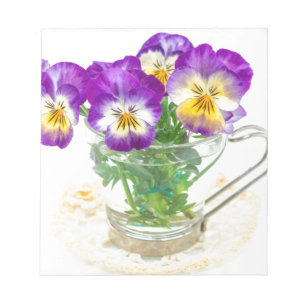beautiful pansy flowers isolated in a cup notepad