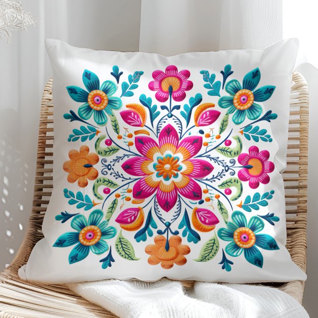 Beautiful Pink Turquoise Orange Mexican Floral Throw Pillow (Beautiful Pink Turquoise Orange Mexican Floral Throw Pillow on a sunny rattan chair.)