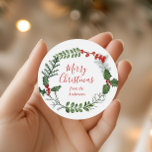 Beautiful Red & Green Watercolor Christmas Wreath Classic Round Sticker<br><div class="desc">A beautiful watercolor greenery and red berry wreath frames your message on this standout holiday sticker. The label tag has elegant typography,  and there is room to personalize.</div>