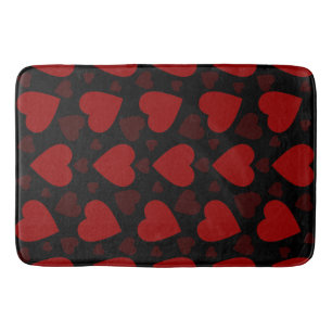 Beautiful red heart pattern on black bath mat