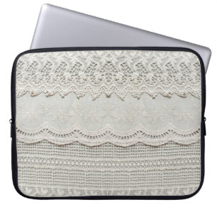Beautiful, subtle, white laced textile close up. laptop sleeve