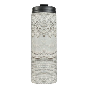 Beautiful, subtle, white laced textile close up. thermal tumbler