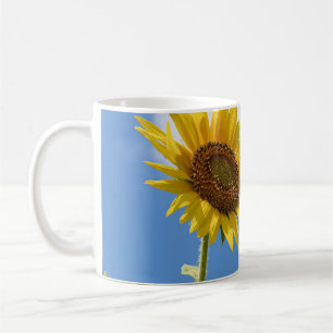 beautiful sun flowers with cloudy blue sky coffee mug