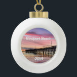 Beautiful Sunset at Newport Beach Ceramic Ball Christmas Ornament<br><div class="desc">This ornament makes a unique keepsake to remember any visit to fabulous Newport Beach.  Change the date to the current year.  The font style can be changed as well as the size,  colour and location.  Three options for the back image also.</div>