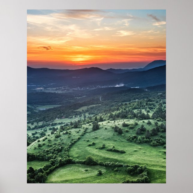 Beautiful sunset behind green fields poster (Front)