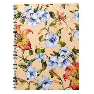 Beautiful tiger lilies and small blue flowers on t notebook