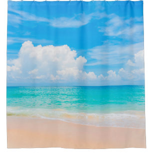 Beautiful tropical beach with blue sky and white c