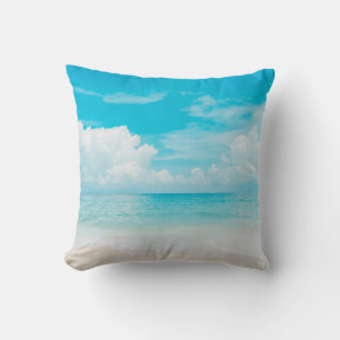 Beautiful tropical beach with blue sky and white c throw pillow