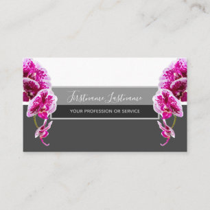 Beautiful violet pink orchid blossoms on grey business card
