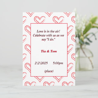 Beautiful wedding invitation with red hearts