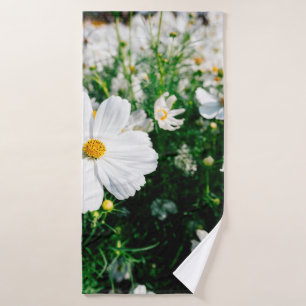 Beautiful white cosmos flowers blooming in gardena bath towel