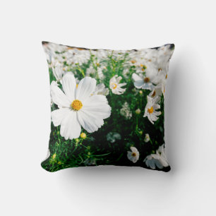Beautiful white cosmos flowers blooming in gardena throw pillow