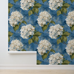 Beautiful white hydrangea on blue wallpaper
